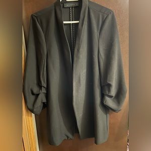 Dress jacket with ruching on sleeves. Longer jacket